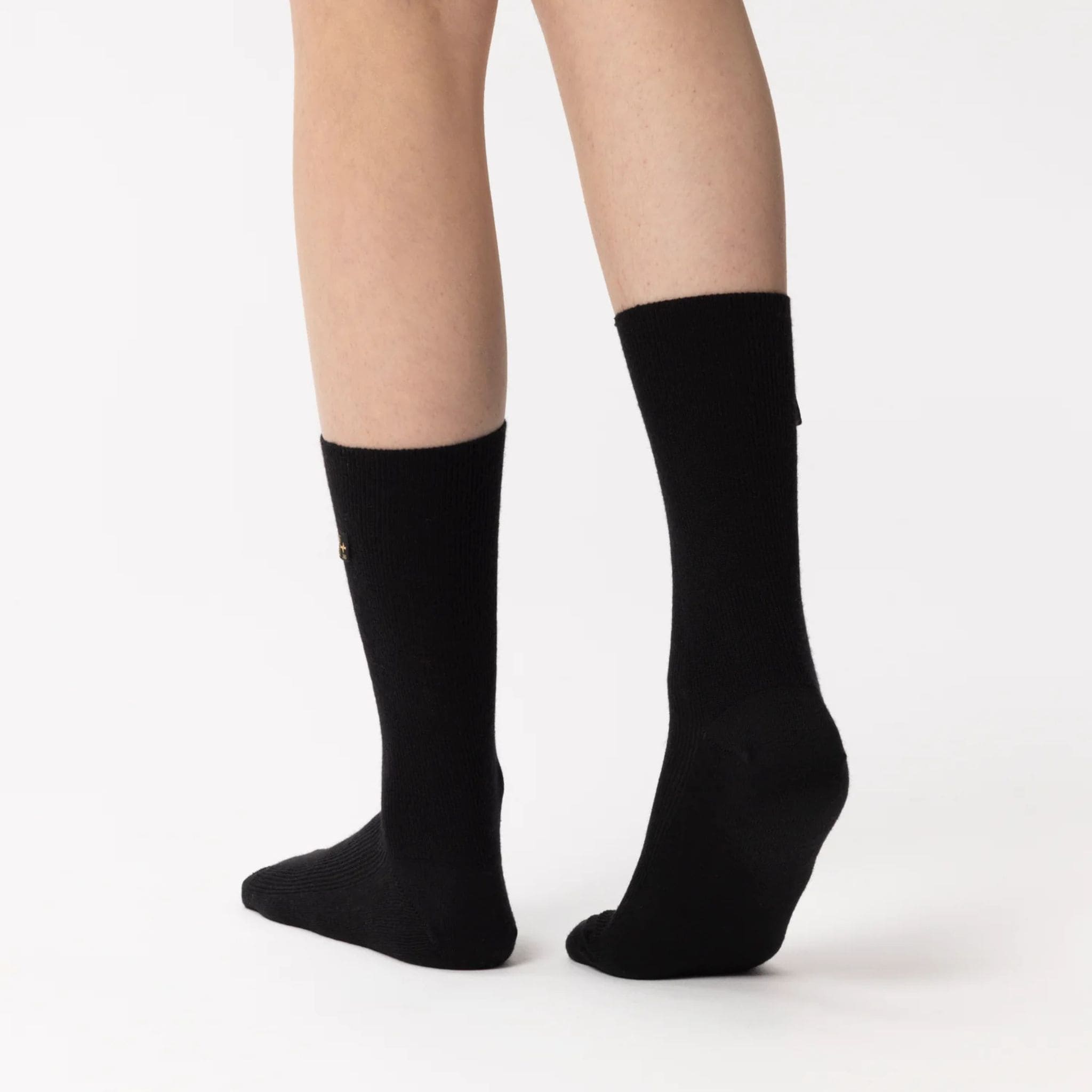 Frau mit Merinosocke