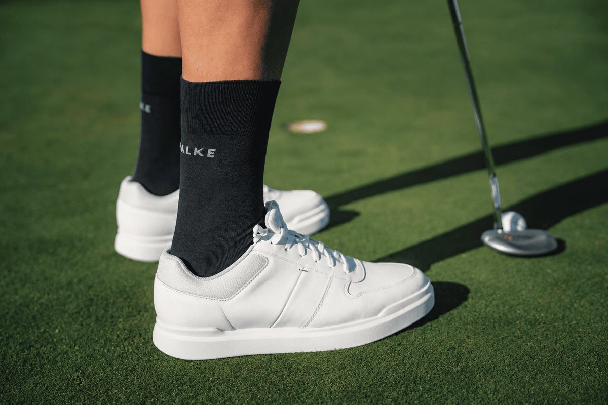 Golf Spieler mit Falke Socke